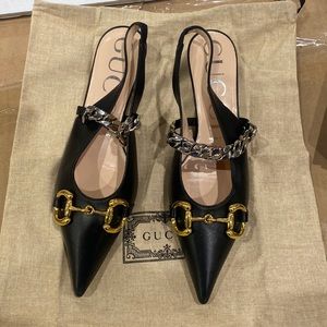 Gucci women’s black horse bit shoes